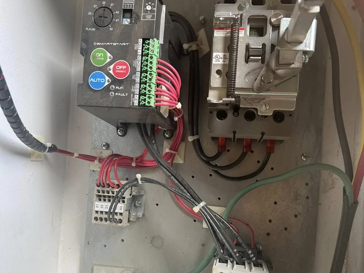 Inside a well pump control box with the motor starter and contactors wired in