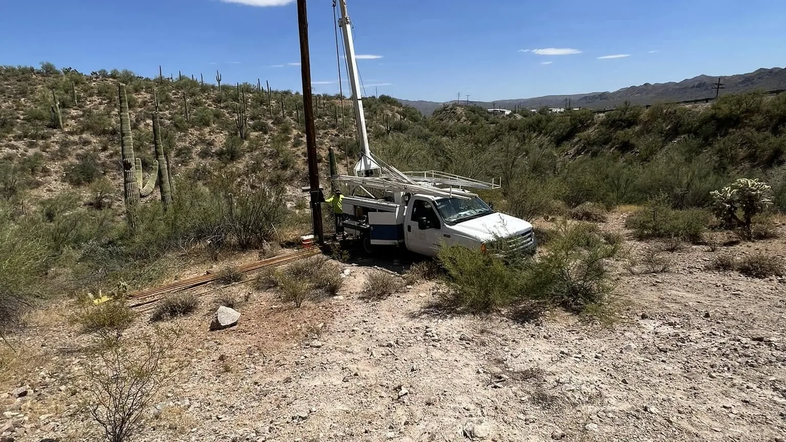 Pump hoist rig working a deep well on a saguaro hillside in the Kearny desert